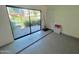 Epoxy floor in garage leads to slider and backyard, providing a great outdoor view at 3233 N 70Th St # 1006, Scottsdale, AZ 85251