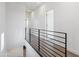 Upstairs hallway with open railing at 3233 N 70Th St # 1006, Scottsdale, AZ 85251