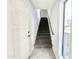 Hallway of modern condo with stairs to second floor and exterior view window at 3233 N 70Th St # 1006, Scottsdale, AZ 85251
