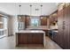 Modern kitchen with stainless steel appliances, white countertops, and wood cabinets at 3233 N 70Th St # 1006, Scottsdale, AZ 85251