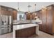 Contemporary kitchen with stainless steel refrigerator, and wooden cabinets at 3233 N 70Th St # 1006, Scottsdale, AZ 85251