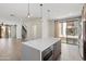 Open concept kitchen with center island, and modern lighting at 3233 N 70Th St # 1006, Scottsdale, AZ 85251