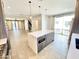 Open-concept kitchen with a central island and stainless steel appliances at 3233 N 70Th St # 1006, Scottsdale, AZ 85251