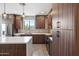 Kitchen featuring stainless steel appliances, wood cabinets, and a white countertop island at 3233 N 70Th St # 1006, Scottsdale, AZ 85251
