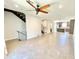 Open floor plan with living room, kitchen, and staircase with metal railing at 3233 N 70Th St # 1006, Scottsdale, AZ 85251