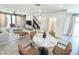Open-concept living area featuring modern furnishings, sleek staircase, and ample natural light at 3233 N 70Th St # 1006, Scottsdale, AZ 85251