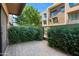 Private back patio area with brick pavers and mature landscaping for added privacy at 3233 N 70Th St # 1006, Scottsdale, AZ 85251