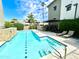 A community pool and lounging area with tables, chairs and grilling area at 3233 N 70Th St # 1006, Scottsdale, AZ 85251