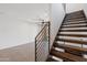 Wooden staircase with metal railings leading to a living space at 3233 N 70Th St # 1006, Scottsdale, AZ 85251