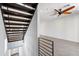 Modern stairway with dark wood treads and sleek metal railing in an open-concept space at 3233 N 70Th St # 1006, Scottsdale, AZ 85251