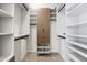 Custom walk-in closet featuring shelving, hanging racks, and a central cabinet for organized storage at 3233 N 70Th St # 1006, Scottsdale, AZ 85251