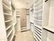 Well-organized walk-in closet with built-in shelves, drawers, and hanging rods for ample storage at 3233 N 70Th St # 1006, Scottsdale, AZ 85251
