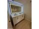 Bathroom featuring a double sink, a backlit mirror, and luxury finishes at 349 E Thomas Rd # E301, Phoenix, AZ 85012