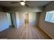 Bedroom featuring plank flooring, a window, and a ceiling fan at 349 E Thomas Rd # E301, Phoenix, AZ 85012