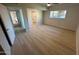 This bright bedroom features new plank flooring, ceiling fan, and a large window at 349 E Thomas Rd # E301, Phoenix, AZ 85012