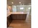 Kitchen island with gray cabinets, light countertop, and wood floors at 349 E Thomas Rd # E301, Phoenix, AZ 85012