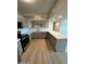 Well-lit kitchen featuring gray cabinets, modern appliances and white countertops at 349 E Thomas Rd # E301, Phoenix, AZ 85012