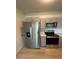 Kitchen featuring stainless steel appliances, gray cabinets and light wood floors at 349 E Thomas Rd # E301, Phoenix, AZ 85012