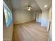 Main bedroom showcasing plank flooring, a ceiling fan, and a large window at 349 E Thomas Rd # E301, Phoenix, AZ 85012