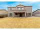Two-story home featuring an open backyard with covered patio and a view from the yard at 3663 S Soho Ln, Chandler, AZ 85286