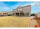 Exterior of the house with a backyard, showcasing the covered patio and landscaping at 3663 S Soho Ln, Chandler, AZ 85286