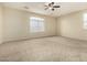 The bright, spacious bedroom includes carpet flooring and window with blinds at 3663 S Soho Ln, Chandler, AZ 85286