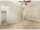 This neutral-toned bedroom features carpet flooring and dual walk-in closets at 3663 S Soho Ln, Chandler, AZ 85286