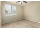 Neutral bedroom features carpeted floors, ceiling fan, and window at 3663 S Soho Ln, Chandler, AZ 85286