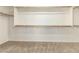 This large walk-in closet includes carpet flooring and lots of shelving at 3663 S Soho Ln, Chandler, AZ 85286