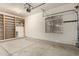 Garage with built-in shelving and a window, offering storage and natural light at 3663 S Soho Ln, Chandler, AZ 85286