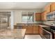 Traditional-style kitchen features stainless steel appliances, and granite countertops at 3663 S Soho Ln, Chandler, AZ 85286