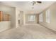 Open-concept living room features carpet floors, ceiling fan, and bright natural light at 3663 S Soho Ln, Chandler, AZ 85286