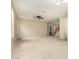 Spacious living room featuring neutral carpet, abundant natural light, and access to staircase at 3663 S Soho Ln, Chandler, AZ 85286