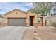 A beautiful single-Gathering home with two-car garage, tidy landscaping, and neutral color palette at 37714 W Capri Ave, Maricopa, AZ 85138