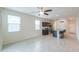 Bright kitchen featuring ample windows, black cabinetry, granite countertops, and an open concept design at 37714 W Capri Ave, Maricopa, AZ 85138