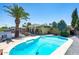Backyard oasis showcasing a sparkling pool, covered patio, and desert landscaping for a private retreat at 3802 E Shaw Butte Dr, Phoenix, AZ 85028