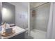 Modern bathroom featuring updated vanity, sink, and a shower-tub combination with a decorative shower curtain at 3802 E Shaw Butte Dr, Phoenix, AZ 85028