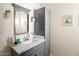 Bathroom featuring a sink with a vanity cabinet, faucet and vanity mirror at 3802 E Shaw Butte Dr, Phoenix, AZ 85028