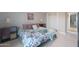 Comfortable bedroom with king bed, modern decor, neutral paint, and serene natural light at 3802 E Shaw Butte Dr, Phoenix, AZ 85028