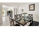 Formal dining room features a large table, modern art, and an open layout to the living spaces at 3802 E Shaw Butte Dr, Phoenix, AZ 85028