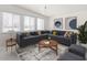 Comfortable living room with a large sectional sofa, stylish decor, and lots of natural light at 3802 E Shaw Butte Dr, Phoenix, AZ 85028