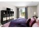 Beautiful bedroom with an abundance of natural light, stylish decor, and cozy bedding at 3802 E Shaw Butte Dr, Phoenix, AZ 85028