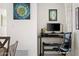 Home office featuring an adjustable black desk and ergonomic chair for a productive workspace at 3802 E Shaw Butte Dr, Phoenix, AZ 85028