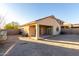 Backyard showcasing the covered patio and block fencing at 45 S 238Th Dr, Buckeye, AZ 85396
