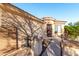 Front entry showcasing a security door and low maintenance desert landscaping at 45 S 238Th Dr, Buckeye, AZ 85396