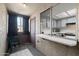 Enclosed balcony looking into a kitchenette with a window, and an accent chair at 461 W Holmes -- # 342, Mesa, AZ 85210