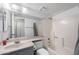 Bathroom featuring a shower-tub combo with a tile surround, a sink, and a toilet at 461 W Holmes -- # 342, Mesa, AZ 85210
