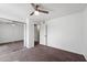 Bedroom with a ceiling fan, carpeted floor, and mirrored closet doors at 461 W Holmes -- # 342, Mesa, AZ 85210