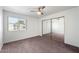 Bedroom featuring a window, ceiling fan and mirrored closet doors at 461 W Holmes -- # 342, Mesa, AZ 85210