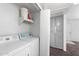 Bright laundry room with washer, dryer, shelving and cupboards for storage at 461 W Holmes -- # 342, Mesa, AZ 85210